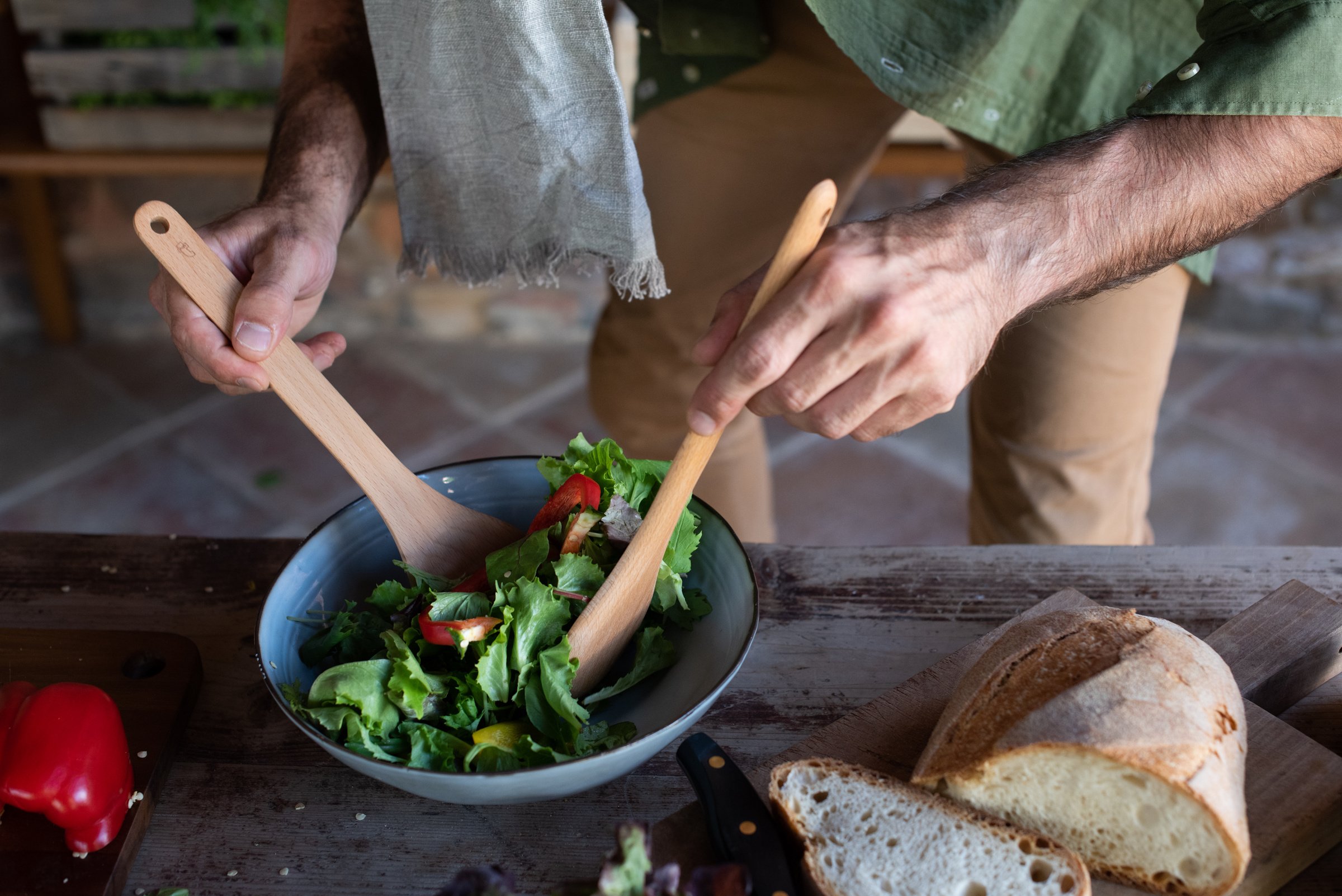 Man Mixing Vegetables in a Bowl